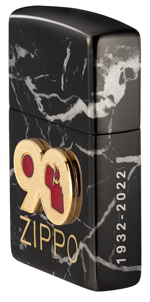 Angled shot of 90th Anniversary "Everyday" Piece Windproof Lighter, showing the front emblem and engraving on the right side.