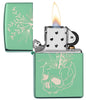 Botanical Design High Polish Green windproof lighter with its lid open and lit