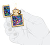 Leaf Design Brushed Brass Windproof Lighter lit in hand