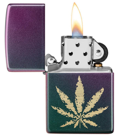 Iridescent Marijuana Leaf Windproof Lighter with its lid open and lit
