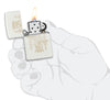 King Queen Design White Matte Windproof Lighter lit in hand.