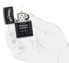 Jack Daniel's® Texture Print Black Matte Windproof Lighter lit in hand